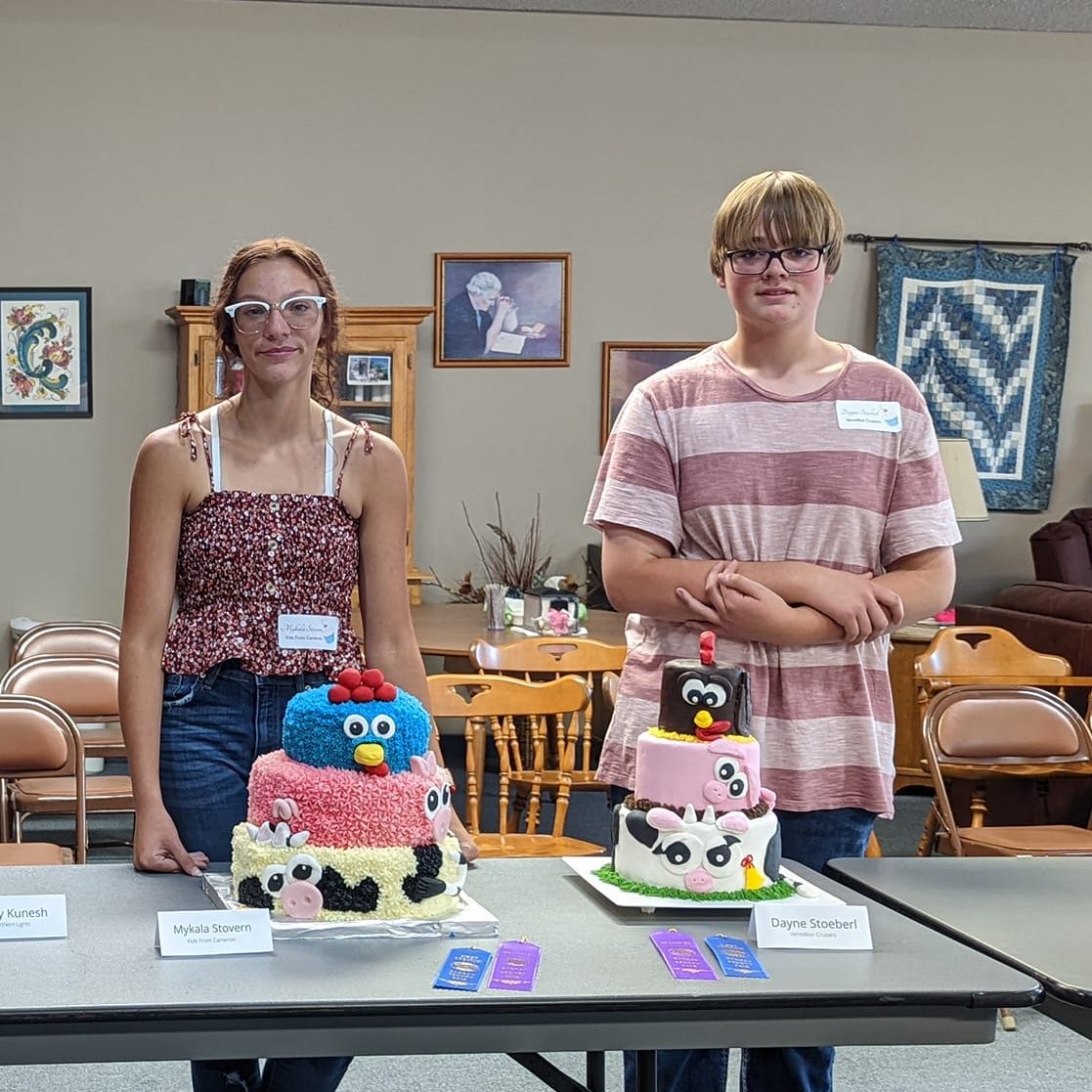 youth showing cakes
